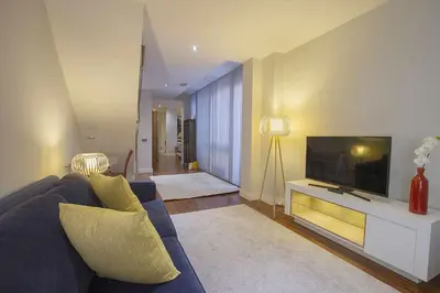 Una televisión o centro de entretenimiento en Apartamentos Libertad 24