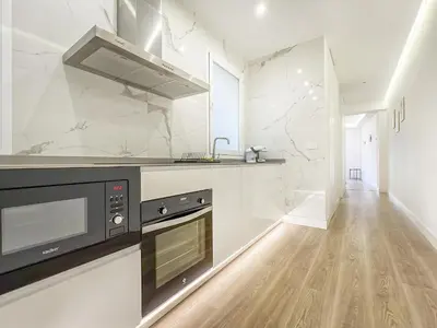 Una cocina o zona de cocina en Piso Amplio 2H/2B Plaza de España Berlany España