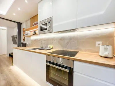 Una cocina o zona de cocina en Piso al lado de Gran Vía 2H/2B Berlany España