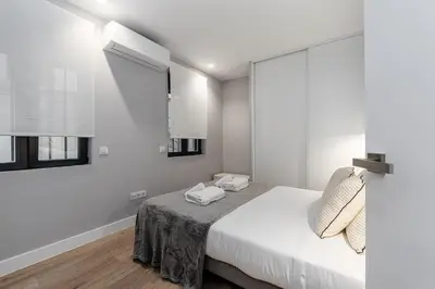 Cama o camas de una habitación en Waou Essence I Lavapiés