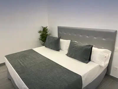 Cama o camas de una habitación en SUARA LOFT APARTAMENTOS