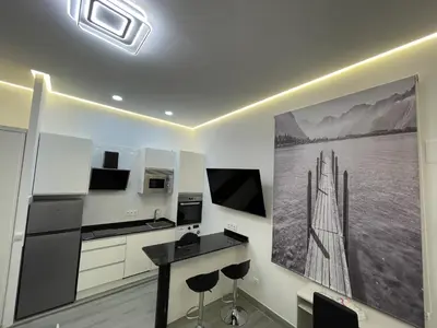 Una televisión o centro de entretenimiento en SUARA LOFT APARTAMENTOS