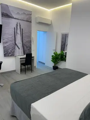 Cama o camas de una habitación en SUARA LOFT APARTAMENTOS