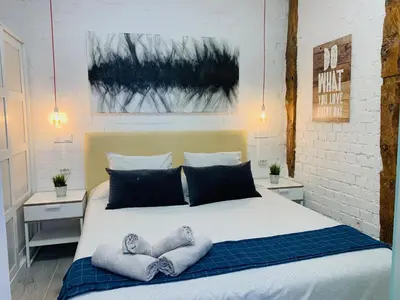 Cama o camas de una habitación en Apartamento con encanto en zona Tirso de Molina-Sol