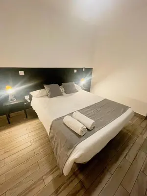 Cama o camas de una habitación en Arce habitaciones