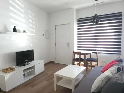Una televisión o centro de entretenimiento en Precioso estudio con dos ambientes