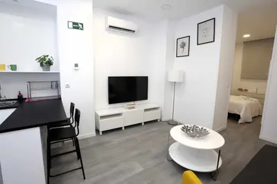 Una televisión o centro de entretenimiento en Apartamento Principe de Vergara