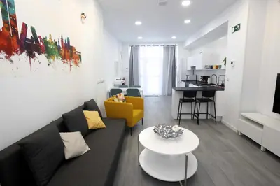 Una televisión o centro de entretenimiento en Apartamento Principe de Vergara