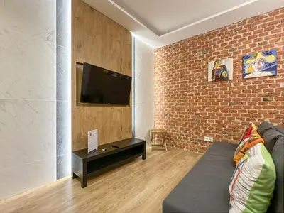 Una televisión o centro de entretenimiento en Piso Moderno 2H/2B Barrio Salamanca Berlany España