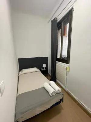 Cama o camas de una habitación en Toledo habitaciones