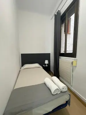 Cama o camas de una habitación en Toledo habitaciones