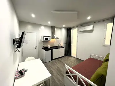 Una televisión o centro de entretenimiento en Cómodo apartamento Mayor y Sol
