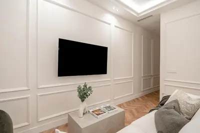 Una televisión o centro de entretenimiento en Chamberi V 2BR 2BH