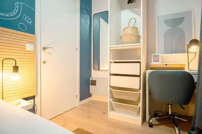 Cama o camas de una habitación en Live it Madrid Gran Vía