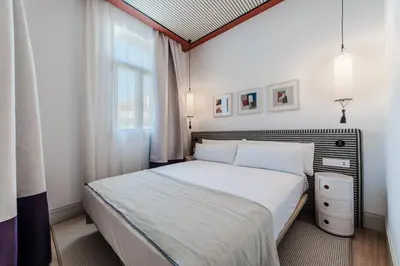 Cama o camas de una habitación en Apartamentos Soho Boutique Hoy No Me Puedo Levantar