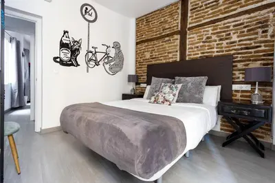 Cama o camas de una habitación en DOWNTOWN La LATINA Grupos, by MONARO*****