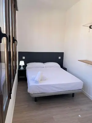 Cama o camas de una habitación en Atocha habitaciones