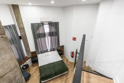 Cama o camas de una habitación en VR OBREGON APARTMENTS