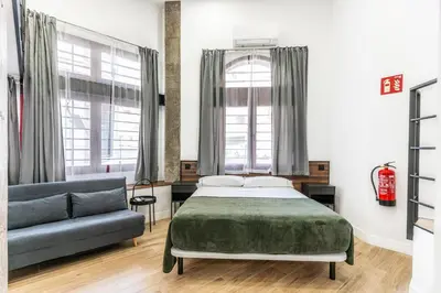 Cama o camas de una habitación en VR OBREGON APARTMENTS
