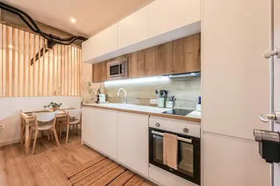 Una cocina o zona de cocina en MyHouseSpain - Acogedor piso cerca de Atocha I