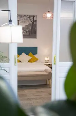 Cama o camas de una habitación en Una Lujosa estancia en las cortes Madrid