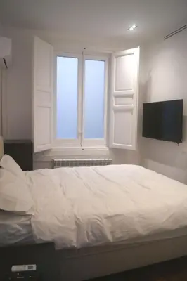 Cama o camas de una habitación en Lujo en el centro