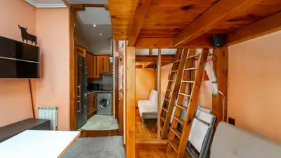 Una televisión o centro de entretenimiento en GuestReady - Cozy stay near Gran Via and Callao