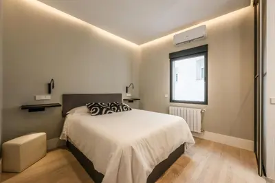 Cama o camas de una habitación en En el corazón de Madrid, casa Moderna