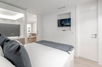 Cama o camas de una habitación en Chamberí Living - Nuevos Apartamentos de Lujo