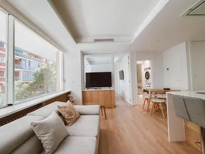 Una televisión o centro de entretenimiento en Chamberí Living - Nuevos Apartamentos de Lujo