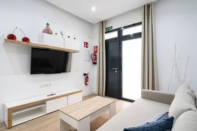 Una televisión o centro de entretenimiento en Apartamento acogedor y cómodo GUAD-C