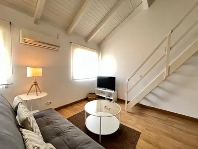 Una televisión o centro de entretenimiento en Duplex Exterior Temporal