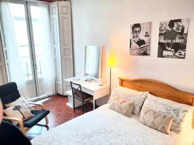 Cama o camas de una habitación en BARRIO DE LAS LETRAS, Corazón de Madrid
