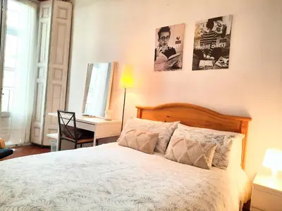 Cama o camas de una habitación en BARRIO DE LAS LETRAS, Corazón de Madrid