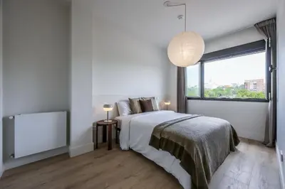 Cama o camas de una habitación en AmazINN Stay Madrid Palacio Real