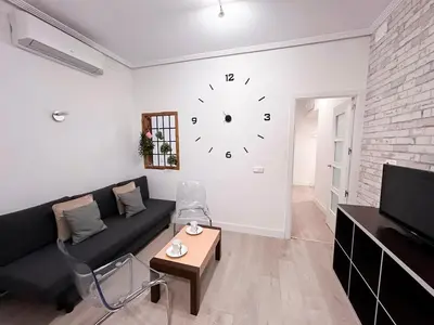 Una televisión o centro de entretenimiento en Vibrant Madrid - Apartamento en pleno centro, AC