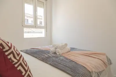 Cama o camas de una habitación en Loft con Terraza Madrid Salitre Temporal