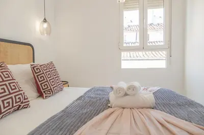 Cama o camas de una habitación en Loft con Terraza Madrid Salitre Temporal