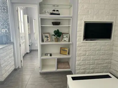 Una televisión o centro de entretenimiento en Piso Madrid Centro 5 min andando Gran Vía