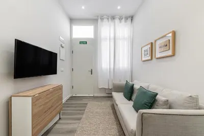 Una televisión o centro de entretenimiento en Waou Fresh Confort I