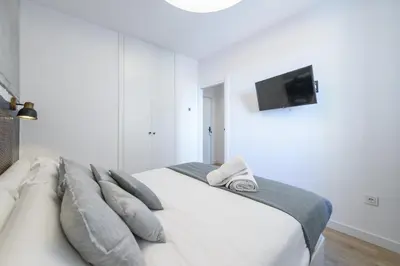 Cama o camas de una habitación en Gran Vía Capitals Residences - by MONARO