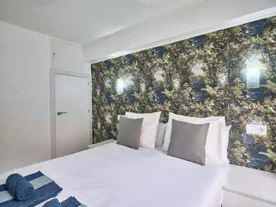 Cama o camas de una habitación en NEW Plaza Elíptica Metro Bus 15 min centro 3d Luxe reformado