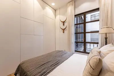 Cama o camas de una habitación en Waou Gran Via VI - Alquiler Corta Duración