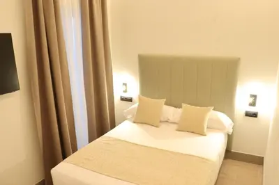 Cama o camas de una habitación en Hostal La Rúa-Montera