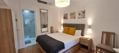 Cama o camas de una habitación en Suites Marqués de Vadillo