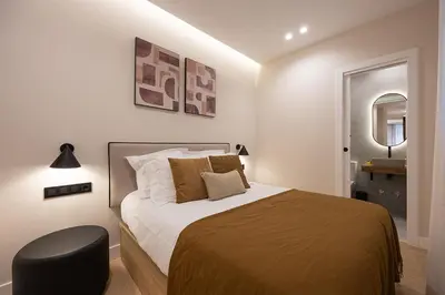 Cama o camas de una habitación en Gran Via XV 4BR 4BH