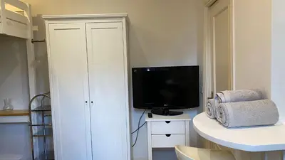 Una televisión o centro de entretenimiento en Apartamento en el casco antiguo