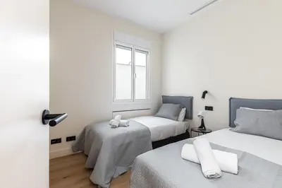 Cama o camas de una habitación en Waou Puerta del Sol VI - Alquiler Corta Duración