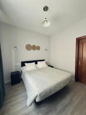 Cama o camas de una habitación en Hostal Conde De Alba