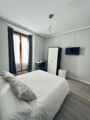 Cama o camas de una habitación en Hostal Conde De Alba
